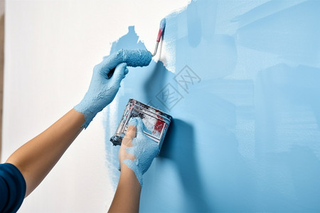 粉刷墙壁的工人高清图片