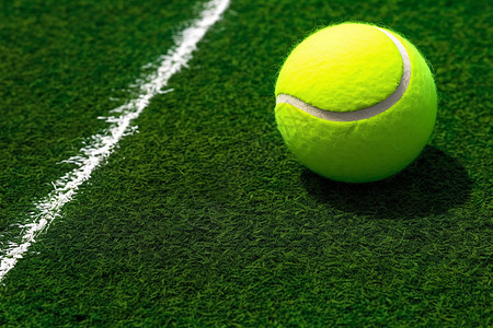 草皮上的网球背景图片