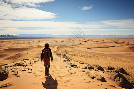 沙漠探险的男子背景图片