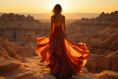 沙漠里的女子背影背景图片