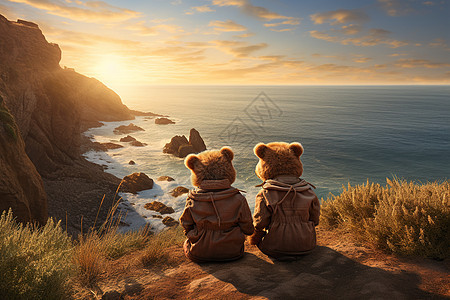 峭壁上的两只泰迪熊俯瞰沙滩日出图片