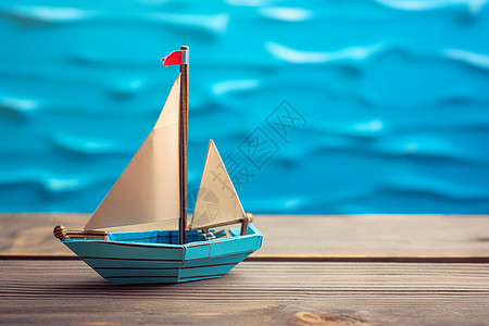 木桌上的一只玩具帆船图片