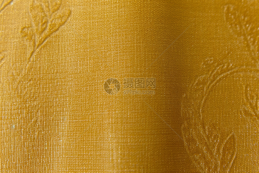 金黄色纹理布料织物背景图片