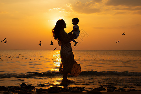 沙滩男孩母子夕阳剪影背景