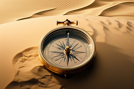 沙丘上的指南针背景图片