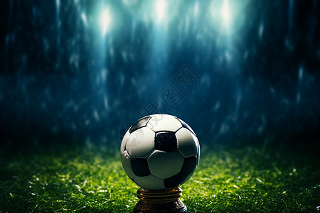黑夜草坪上的足球背景图片