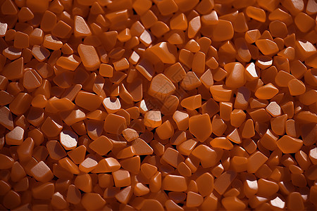 橘色的塑料颗粒材料图片