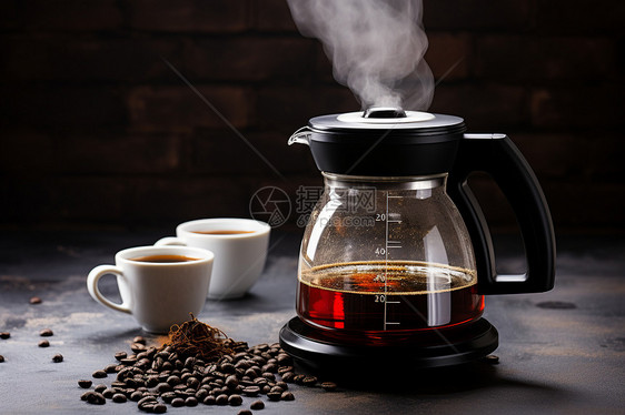 一盏咖啡壶冒着蒸汽图片
