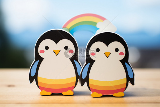 企鹅在彩虹下跳舞图片