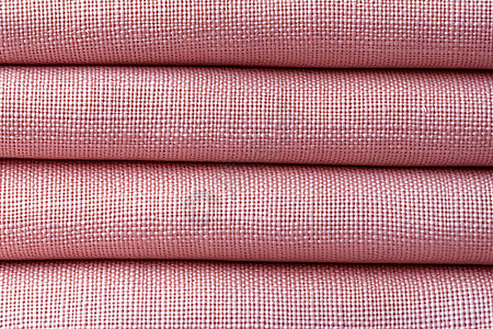 堆积的粉色亚麻布料图片