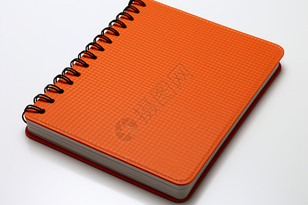 桌面上的橘色笔记本图片