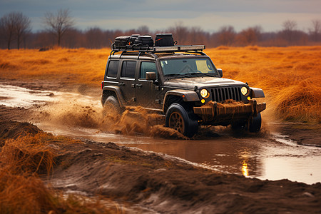 吉普车穿过泥泞的田野图片