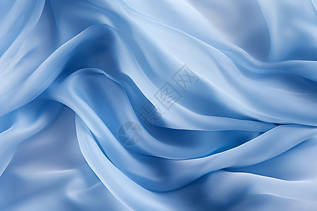 风中飘扬的蓝色丝绸背景图片