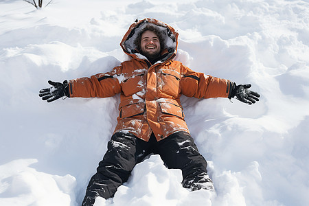 穿着羽绒服的男子躺在雪地上背景图片