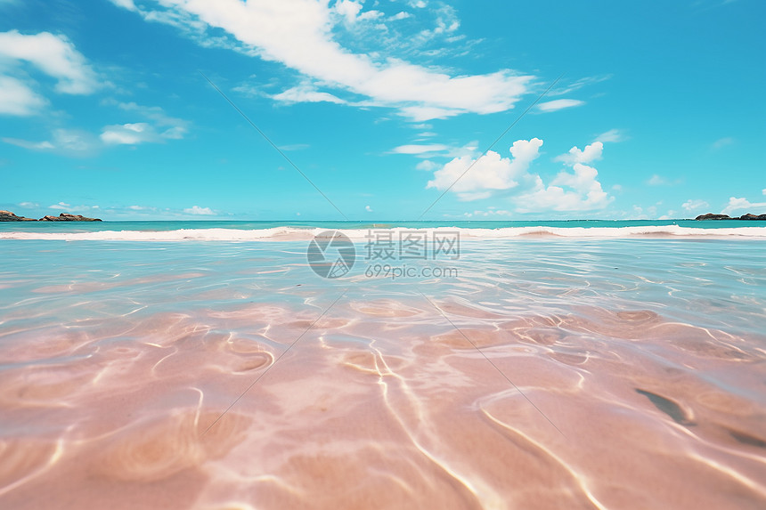 蓝天白云下的粉色沙滩图片