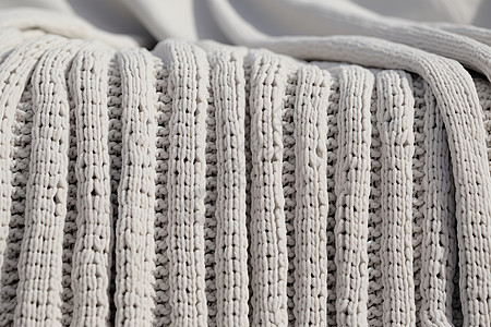 白色毛线编织毯子背景图片