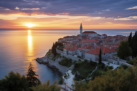 地中海小镇的海上落日景观图片