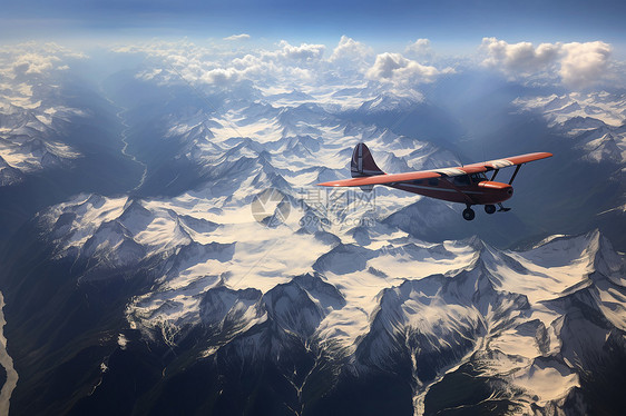 雪山上空翱翔的小型飞机图片