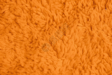 柔软的橙色毛绒盖毯图片