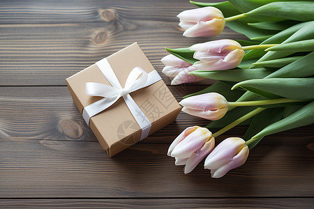 木板上的礼盒和鲜花图片