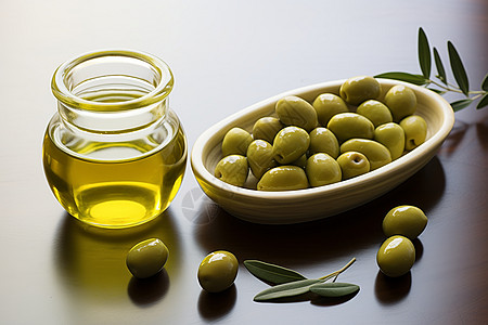 桌子上的橄榄和橄榄油高清图片