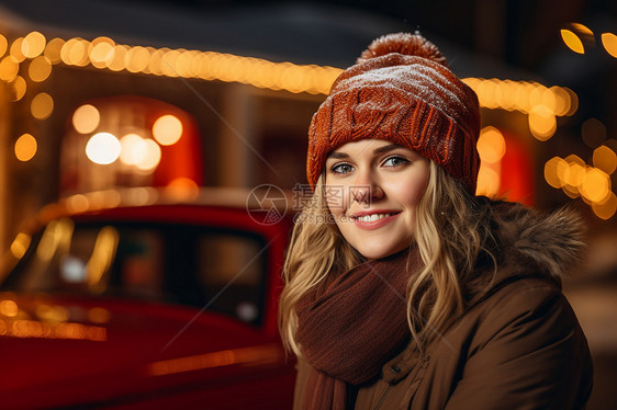 寒冬中的戴着帽子和围巾的女孩图片