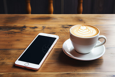 桌子上一杯咖啡和一部手机背景图片