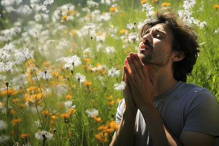 花海中打喷嚏的男子背景图片