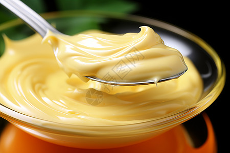 奶油冰棍勺子上的蛋黄酱背景
