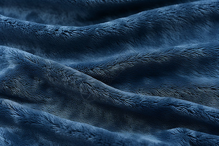 柔软舒适的蓝色毯子背景图片