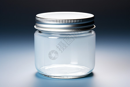 银色盖子的玻璃罐子图片
