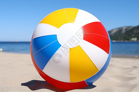 沙滩上放着一个充气的球图片