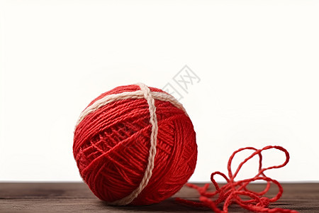 红线缠绕的棉线球背景图片