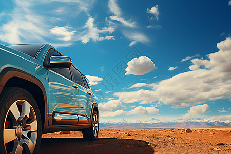 一辆蓝色吉普停在沙漠中高清图片