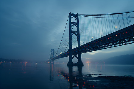 夜晚江面上的悬索桥背景图片