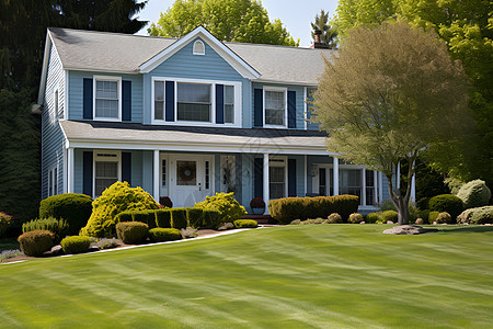 蓝色别墅与大草坪背景图片