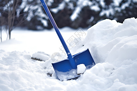 蓝色铲雪工具背景图片