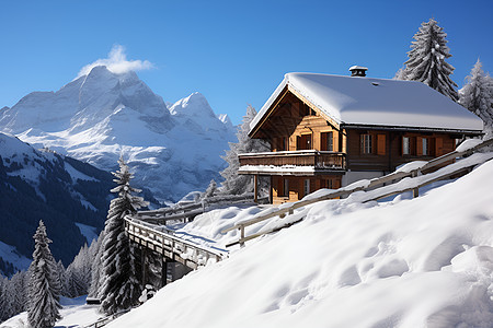 冬日雪山上的小屋图片