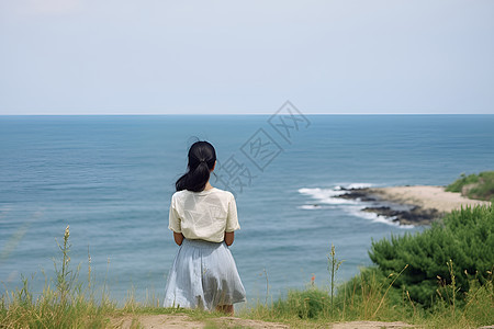 夏季观海拍照的美丽女子图片