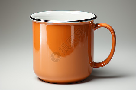 桌面上的橙色杯子背景图片