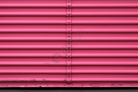 油漆喷刷的粉色卷帘门背景图片