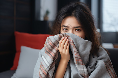 青年女性用毛巾捂住鼻子图片