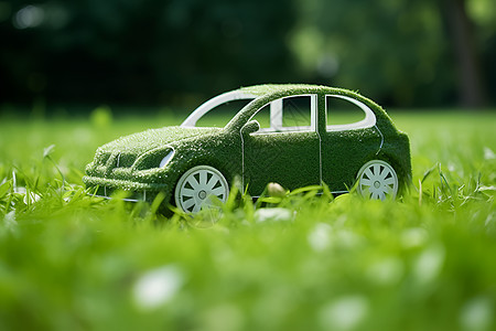 草地上的绿色小车背景图片