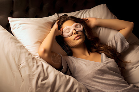 戴眼罩睡觉的女士背景图片