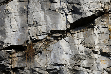 坚硬的岩石峭壁背景图片