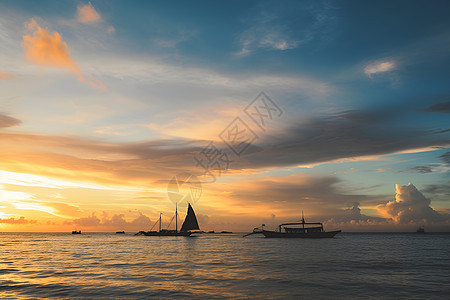 夕阳下的海上帆船背景图片