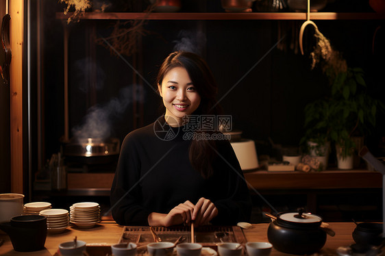 茶桌边煮茶的女人图片