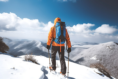 冬季征服山峰的旅者背景图片