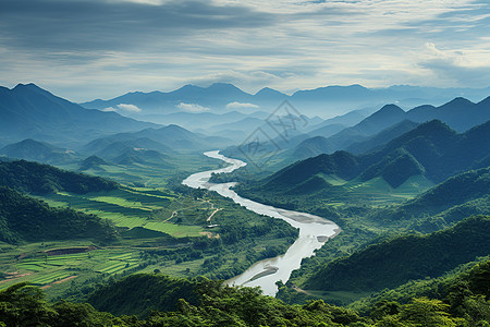 绿色山谷中一条河流图片