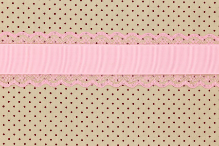粉红丝带复古米色圆点纺织背景